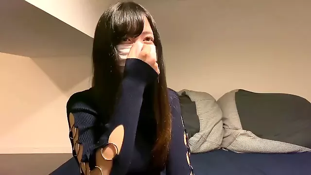 Lovely Asian girl in medical mask does blowjob