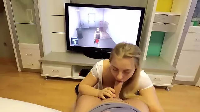 He plays Hitman while she sucks his cock