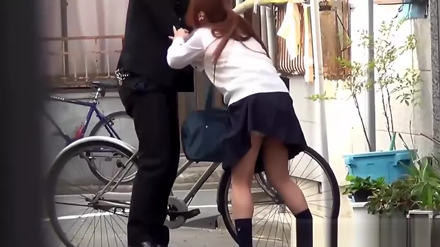 Japanese teen urinates outdoors